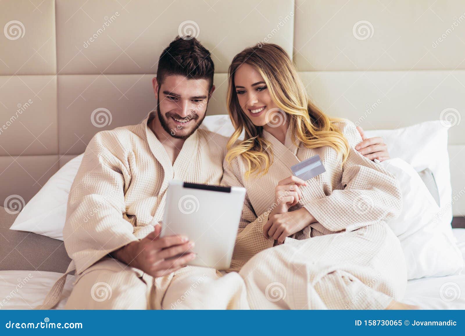 Happy Couple Shopping Online In Luxury Hotel Room Stock Image Ima