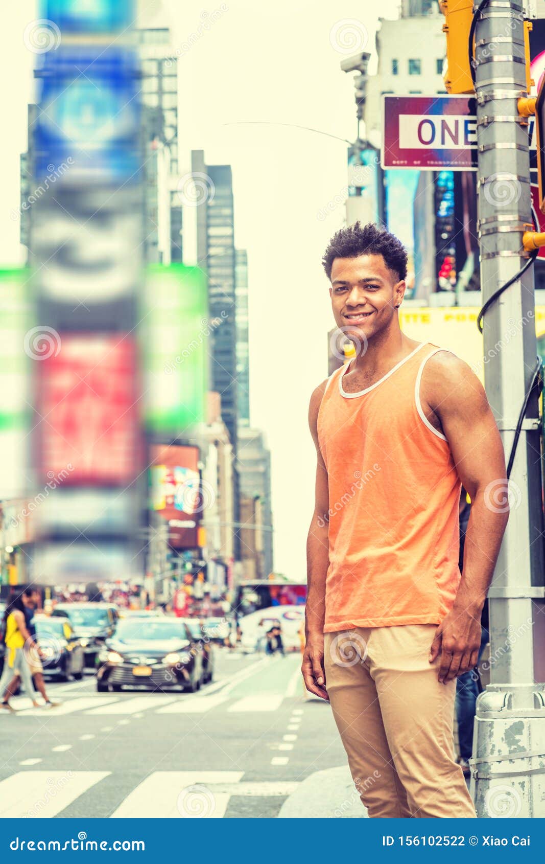 young happy mix race american man traveling in new york city in hot summer