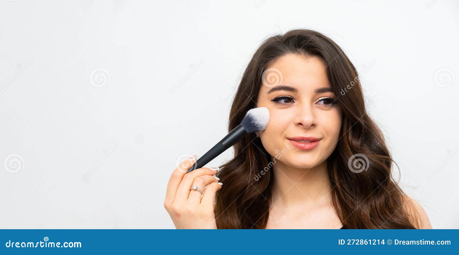 Young Happy Smiling Woman Applying Contouring Or Blush On Cheeks With