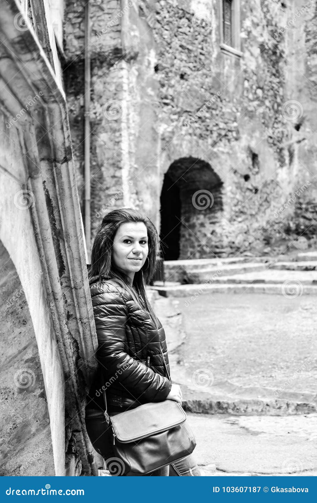 young happy woman at corvin castle, romania