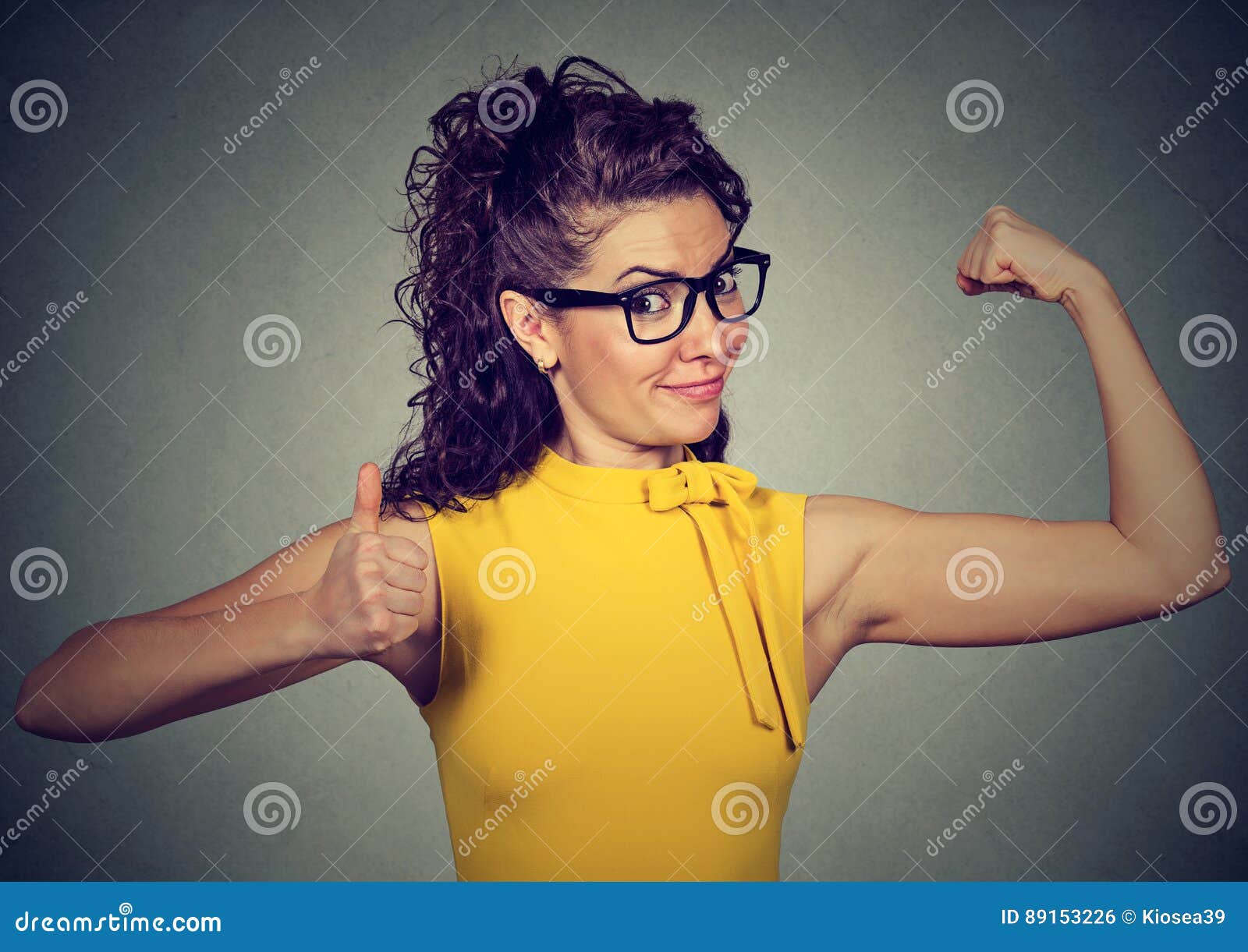 Self Confident Woman Flexing Biceps Muscles Stock Photos - Free &  Royalty-Free Stock Photos from Dreamstime