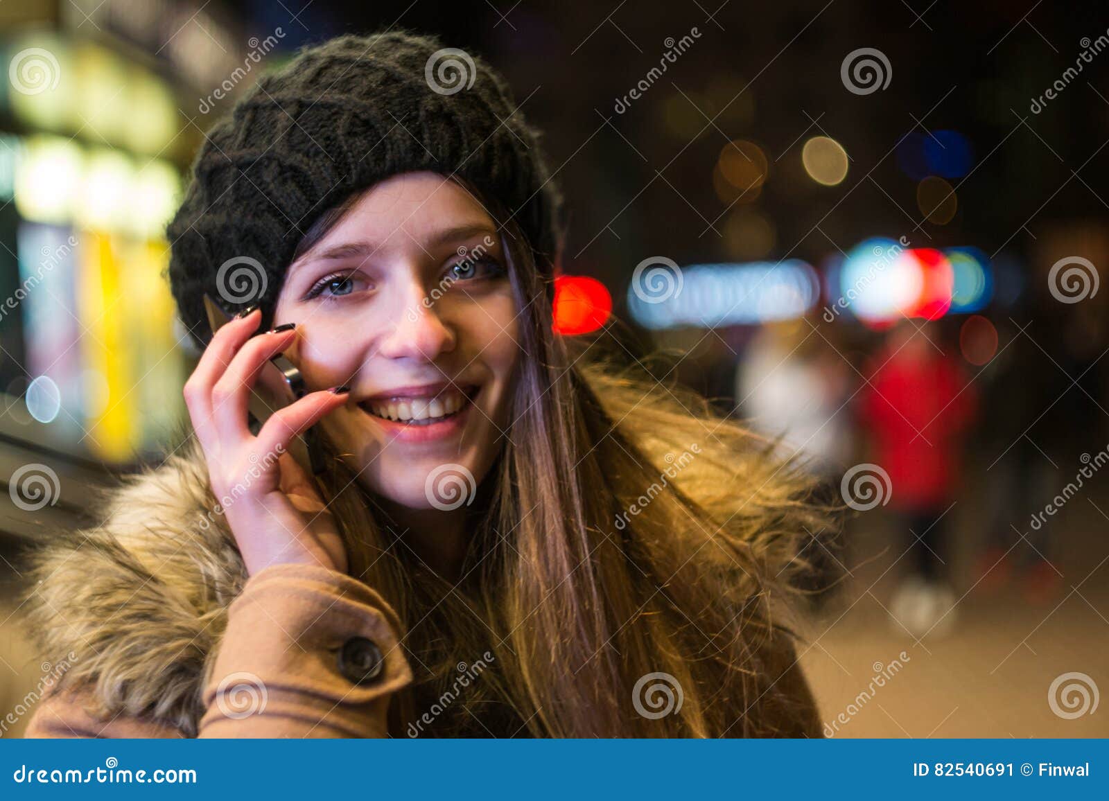 Young Happy Woman Talking on Mobile Phone at Night in Winter Stock ...