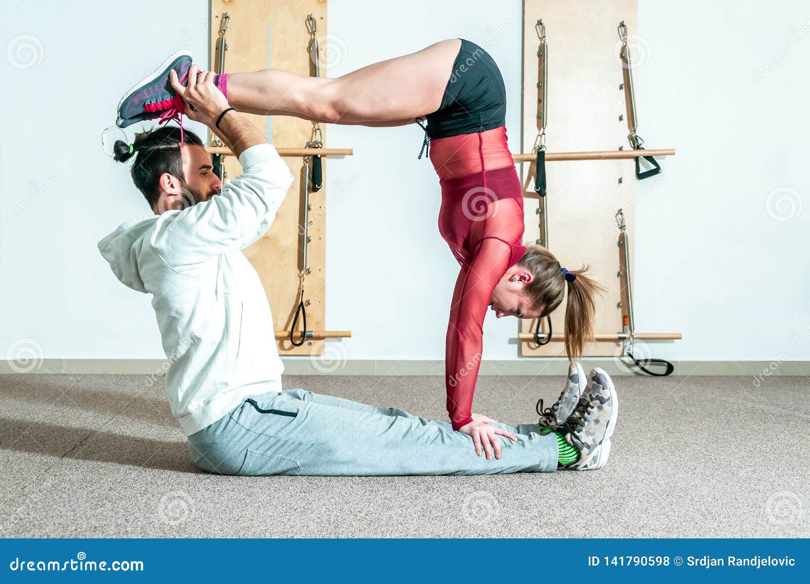 Young Healthy Yoga Fitness Acrobatic Couple Having Fun in the Gym  Performing and Practicing Funny Acrobat Poses Real People Traini Stock  Photo - Image of fitness, coach: 141790598