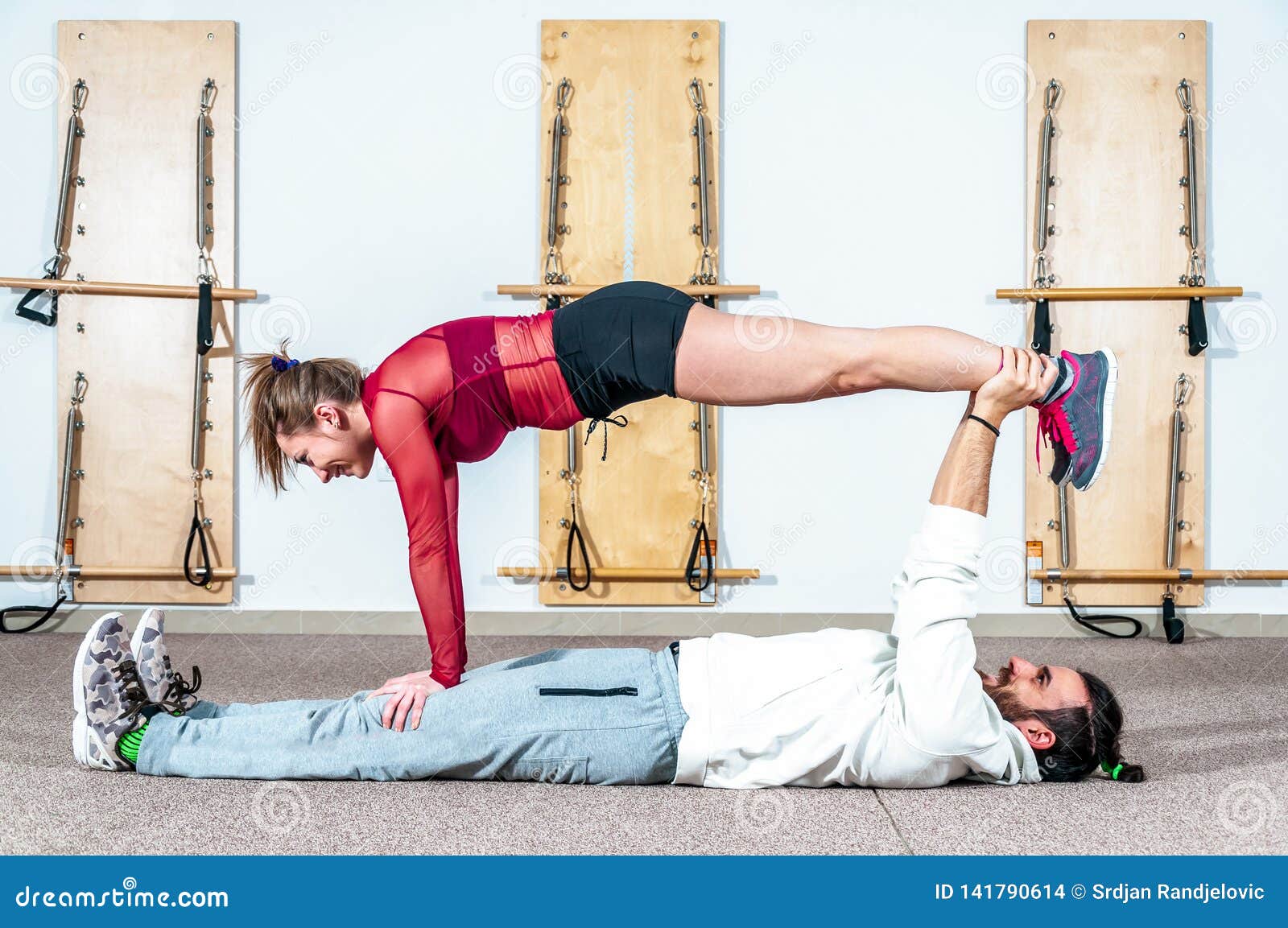 Young Healthy Yoga Fitness Acrobatic Couple Having Fun in the Gym  Performing and Practicing Funny Acrobat Poses Real People Traini Stock  Photo - Image of healthy, hobby: 141790614