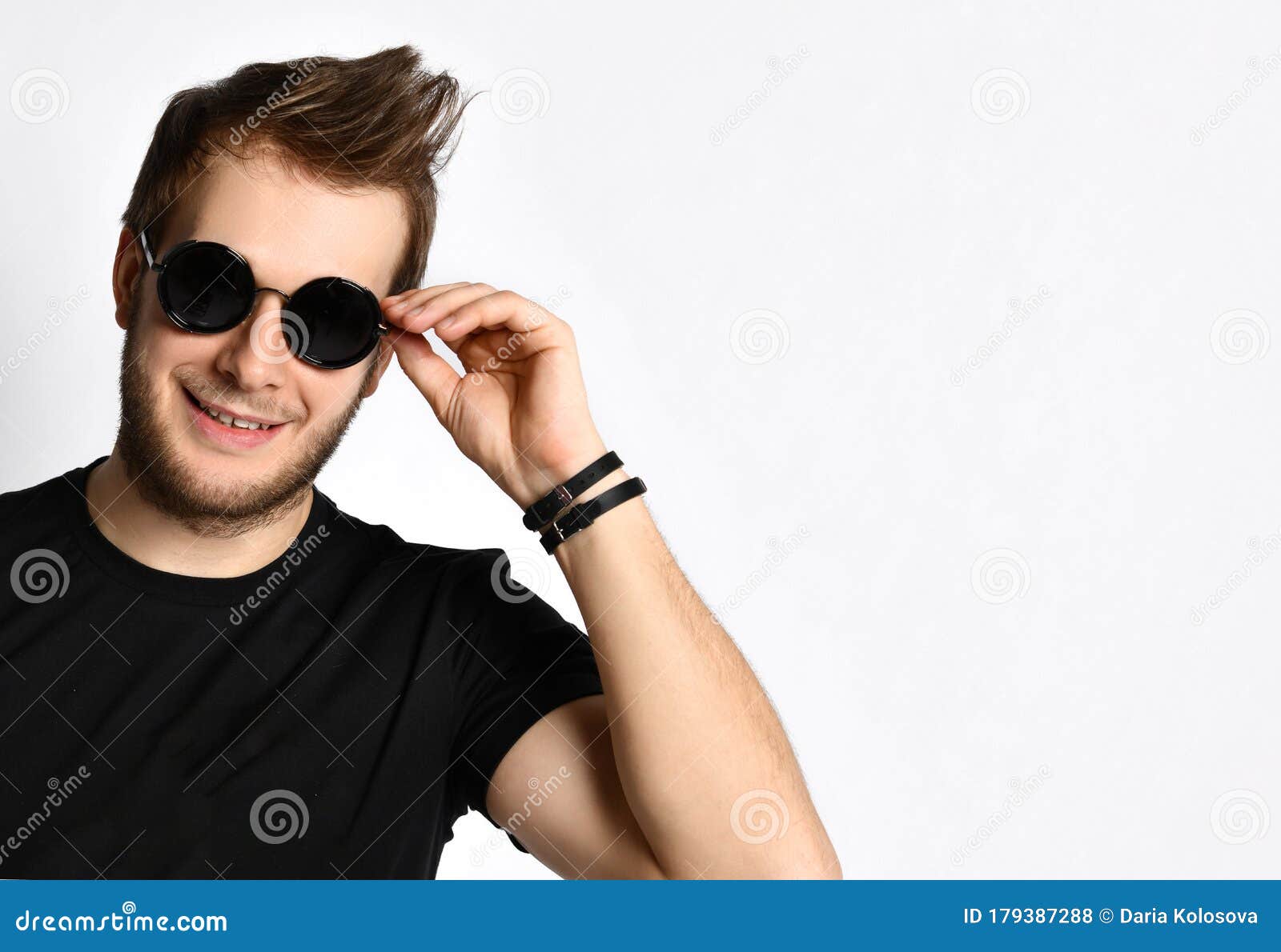 Hipster Guy in Black T-shirt with Print, Bracelets. he is Smiling and ...