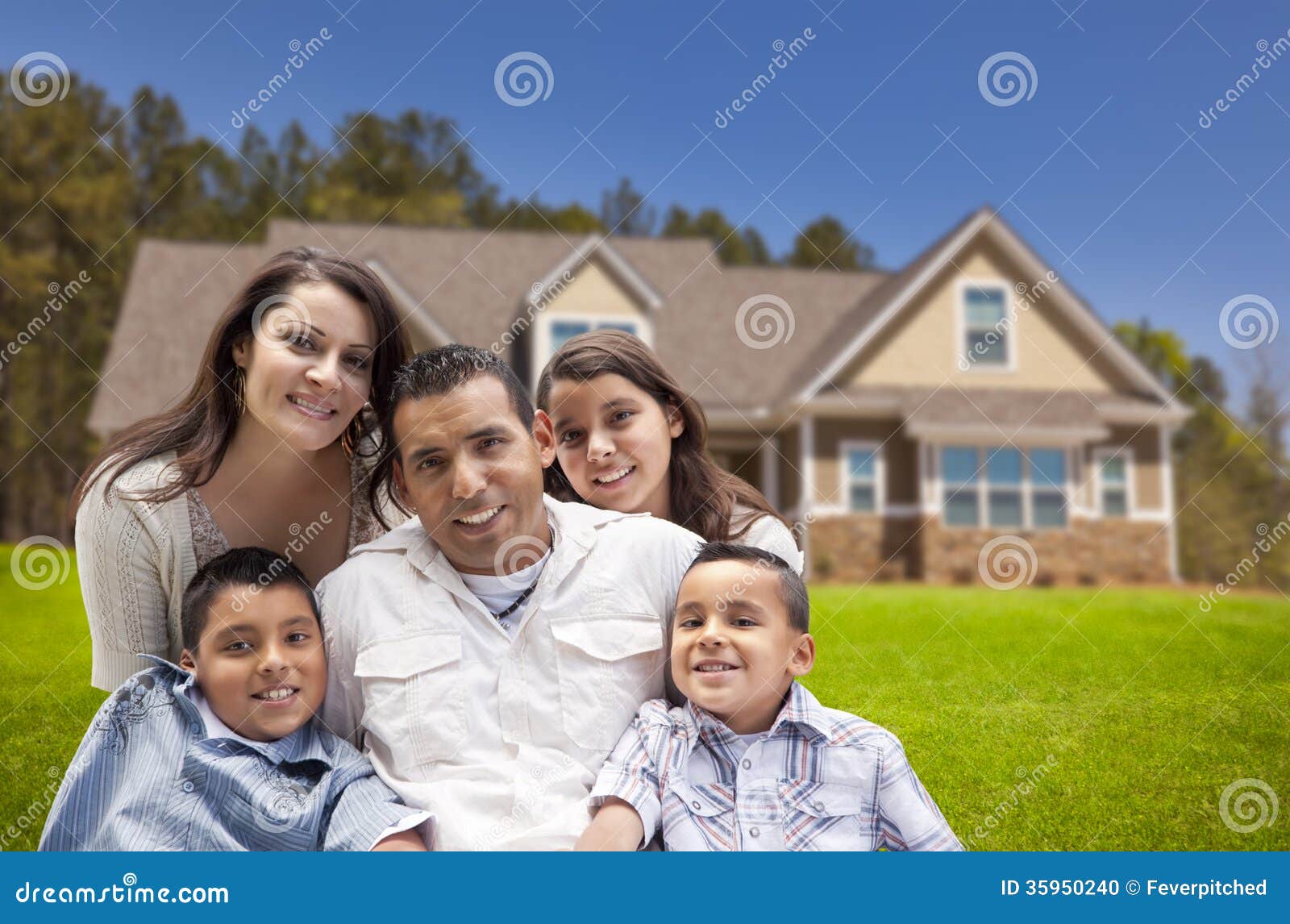 young-hispanic-family-front-their-new-home-happy-35950240.jpg