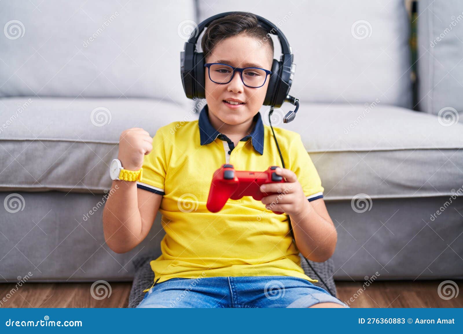 Smiling young child with video game controller Royalty-Free Stock Image -  Storyblocks