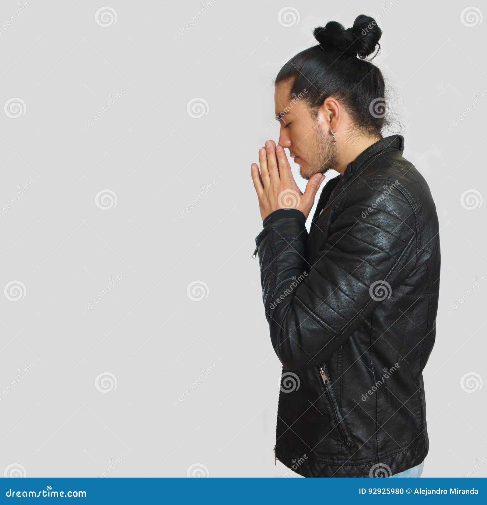 Young Hispanic Man with Gathered Hair Done Bow Wearing Black T-shirt ...