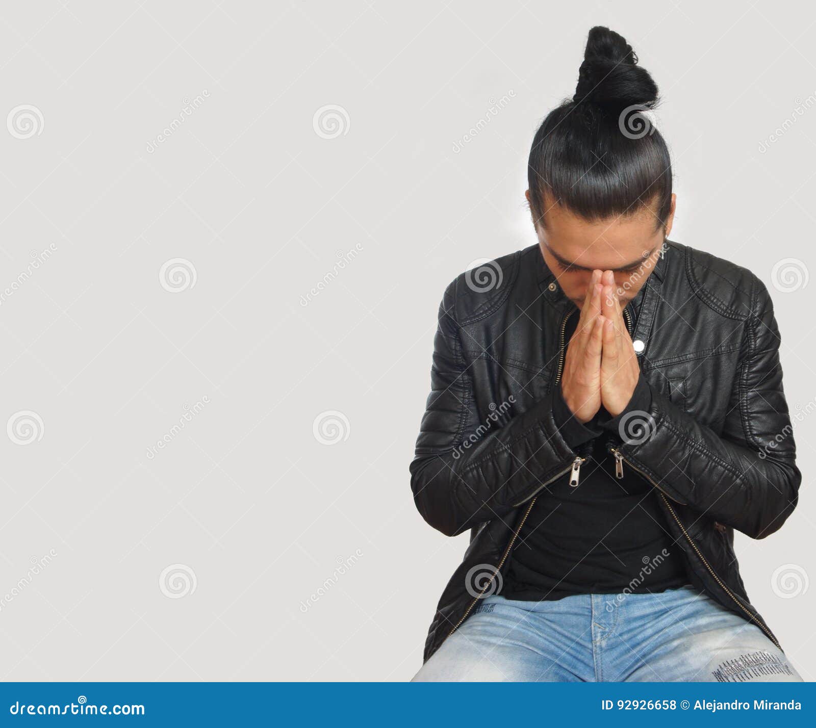 Young Hispanic Man with Gathered Hair Done Bow Wearing Black T-shirt ...