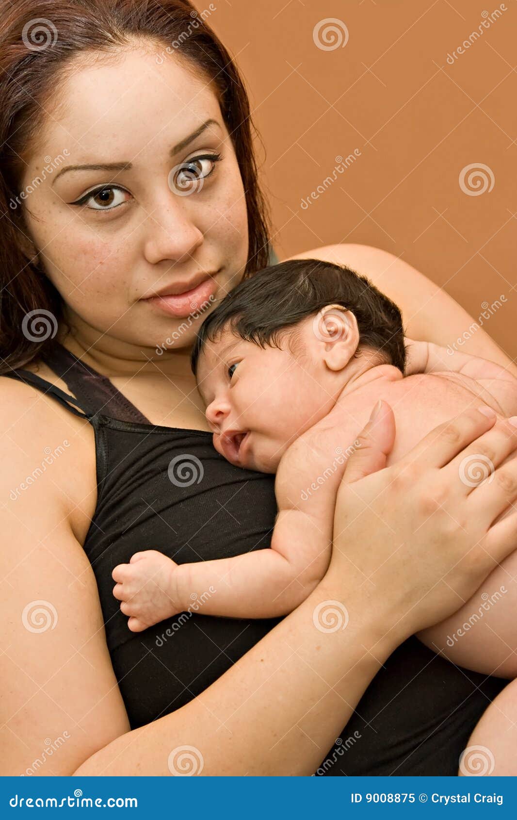 young hispanic mother and newborn infant