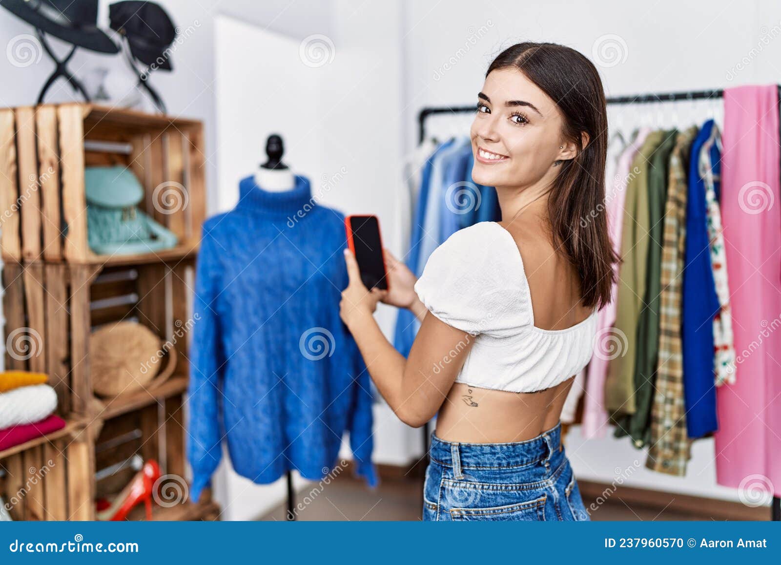 Young Hispanic Woman Make Picture To Manikin at Clothing Store Stock ...