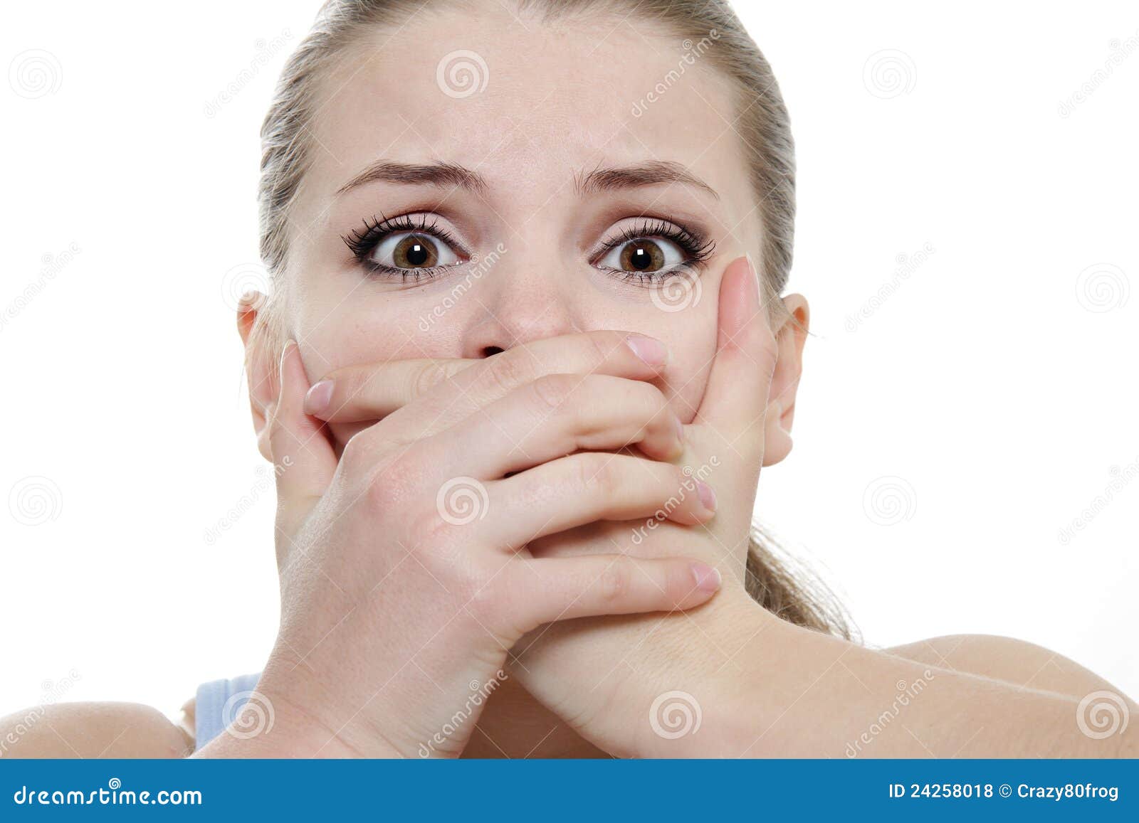 young horrified woman closing her mouth with hands