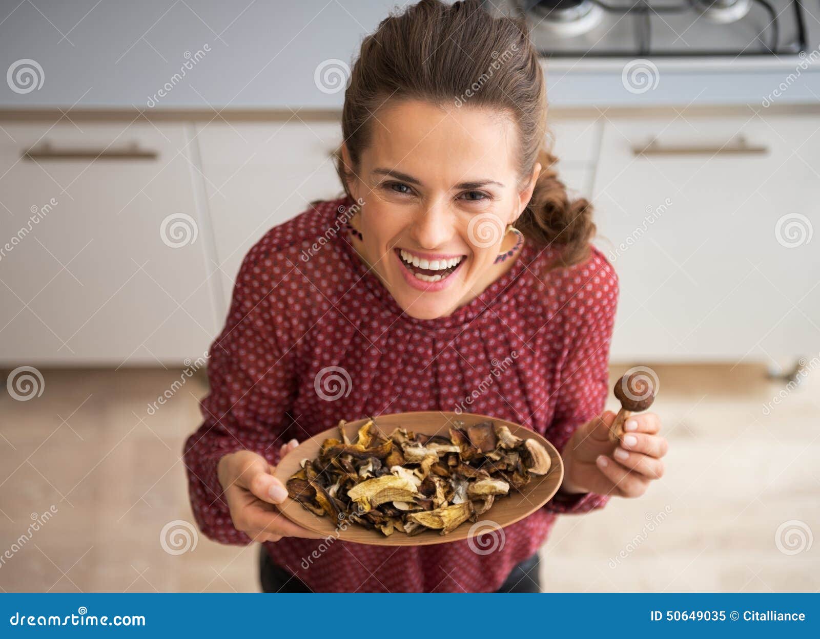 Young Housewife Showing Mushrooms Stoc pic