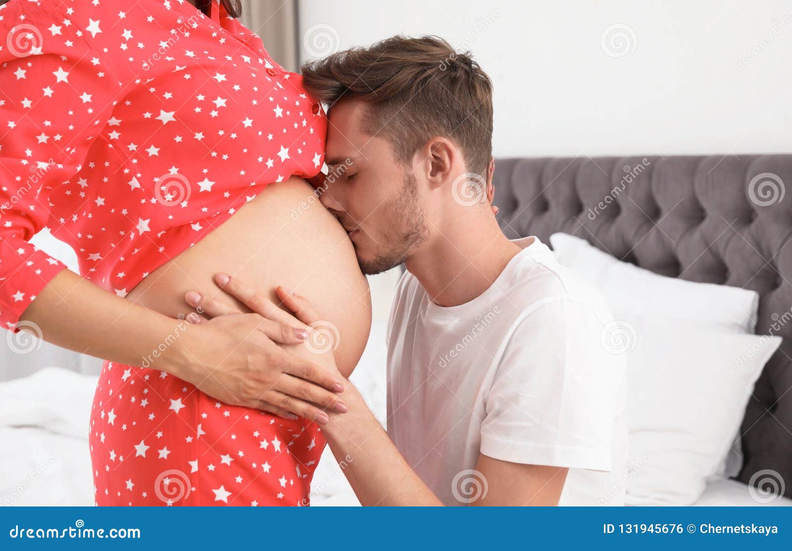 Young Husband Kissing His Pregnant Wife`s Tummy Stock Photo ...