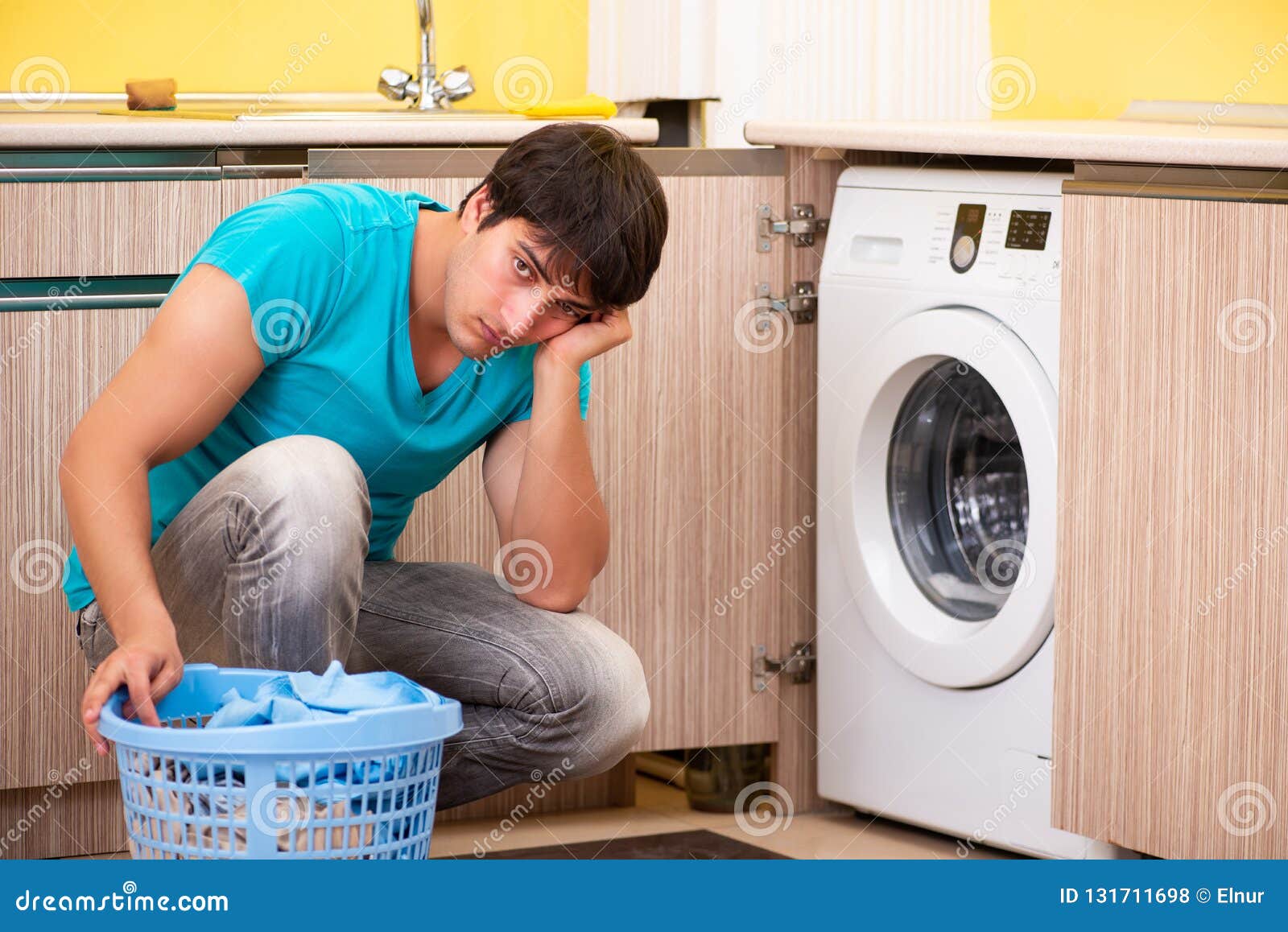 The Young Husband Man Doing Laundry at Home Stock Photo Image of
