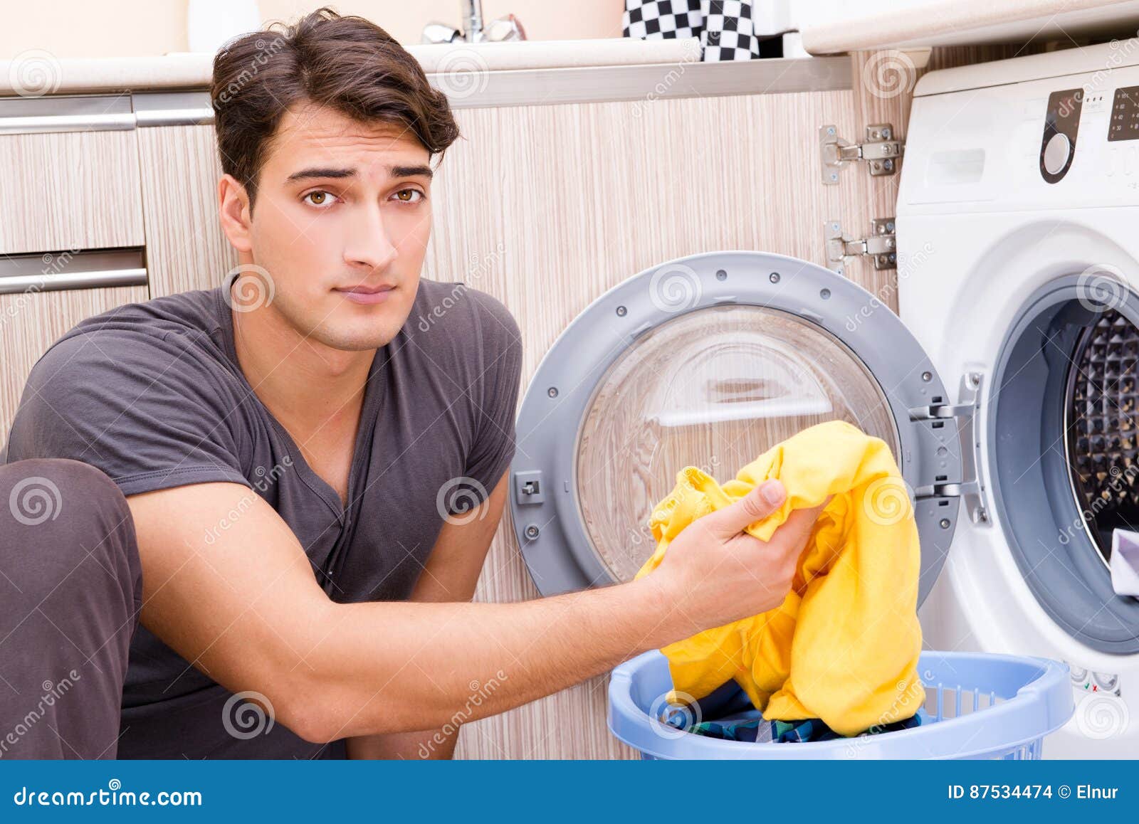 The Young Husband Man Doing Laundry at Home Stock Photo Image of home
