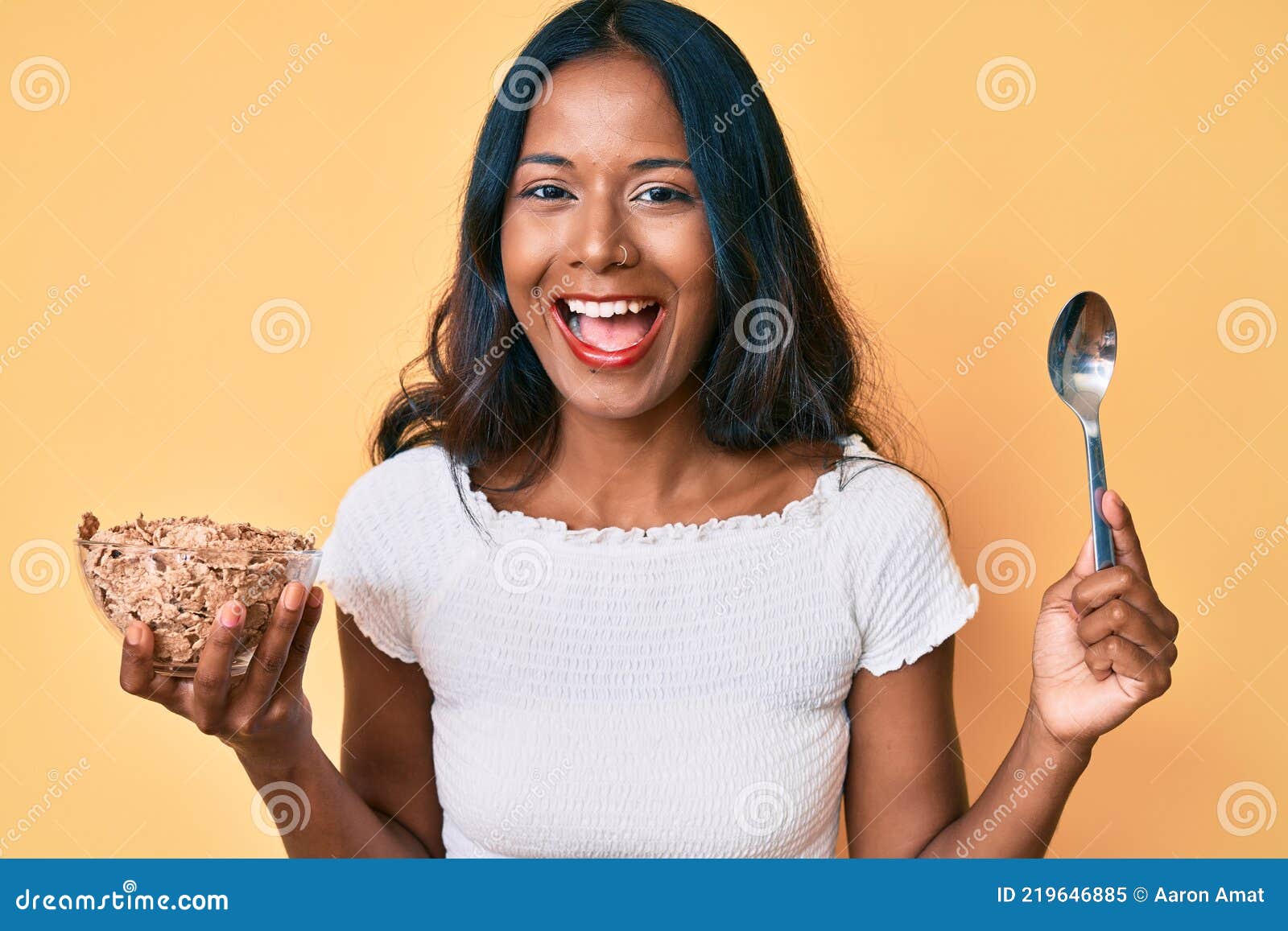 Young Indian Girl Eating Healthy Whole Grain Celears Smiling and Laughing  Hard Out Loud because Funny Crazy Joke Stock Image - Image of friendly,  expression: 219646885