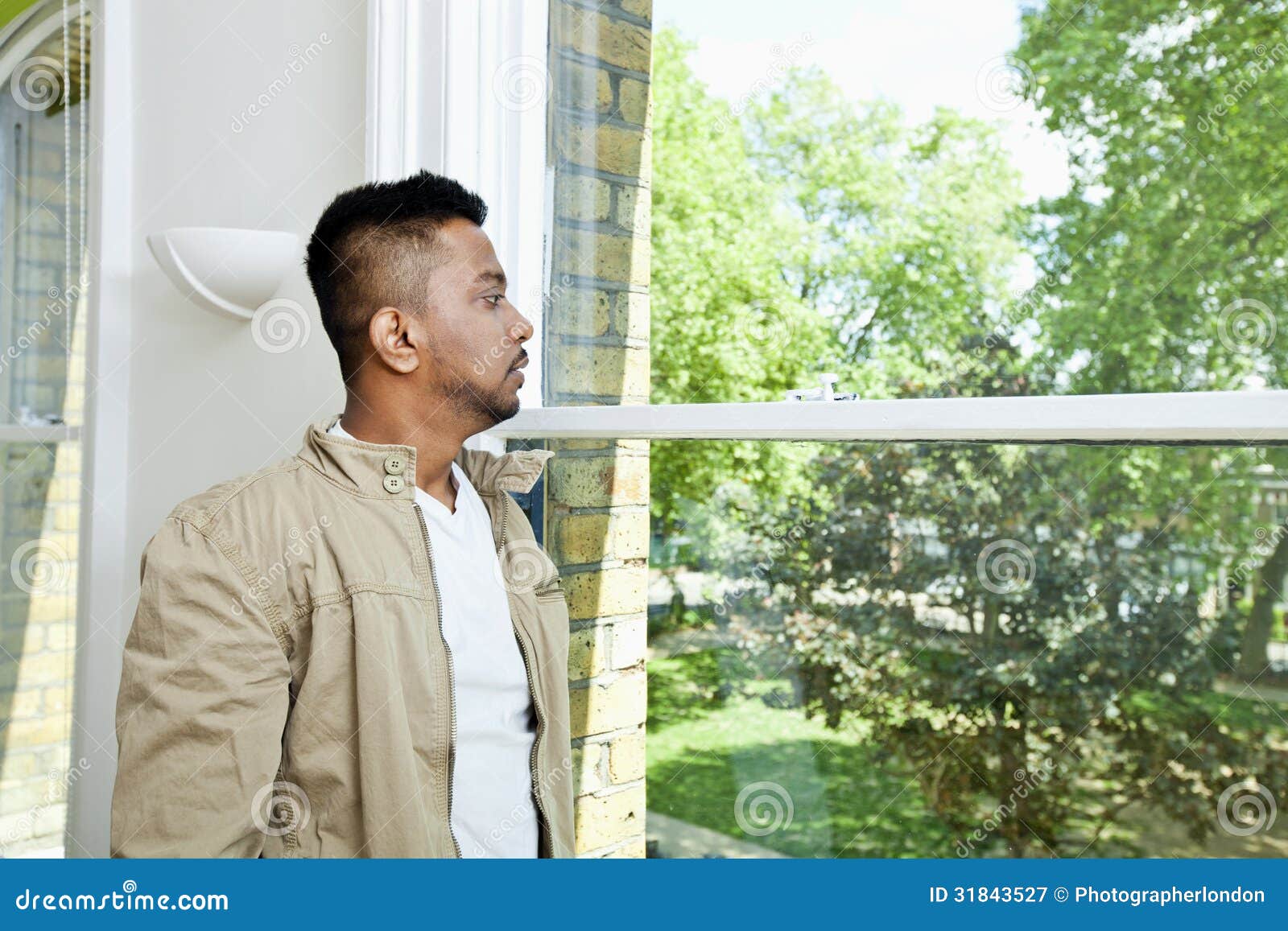 Young man at the window stock photo. Image of casual - 30207172