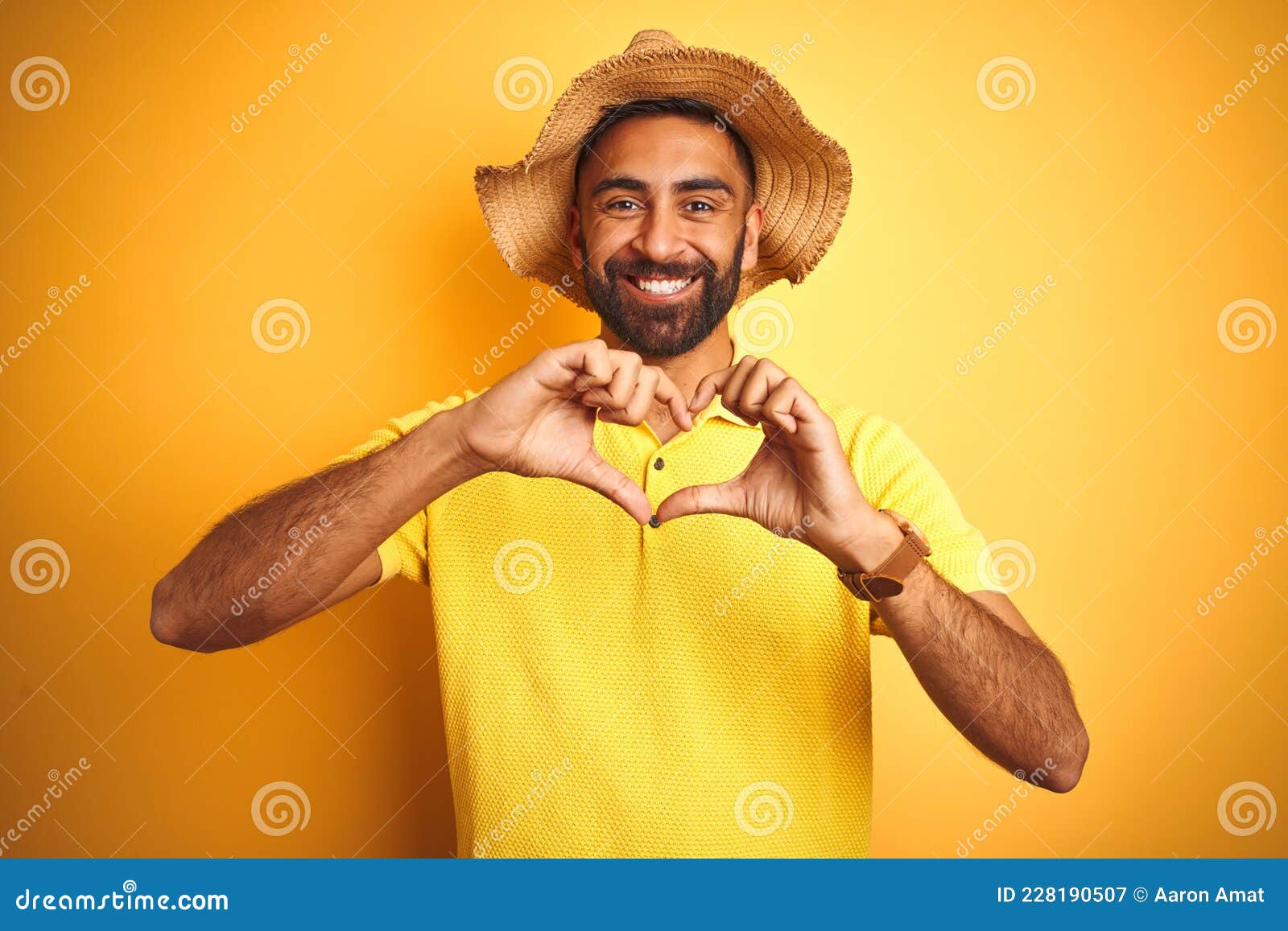 Young Indian Man on Vacation Wearing Summer Hat Standing Over Isolated Yellow Background Smiling Showing Heart Symbol and Stock Image - Image of hispanic, couple: 228190507