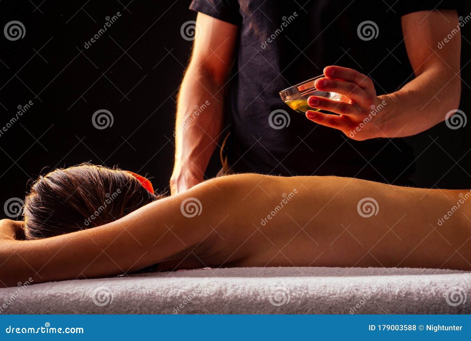 Young Indian Woman Lying On The Table And Getting Ayurvedic Massa