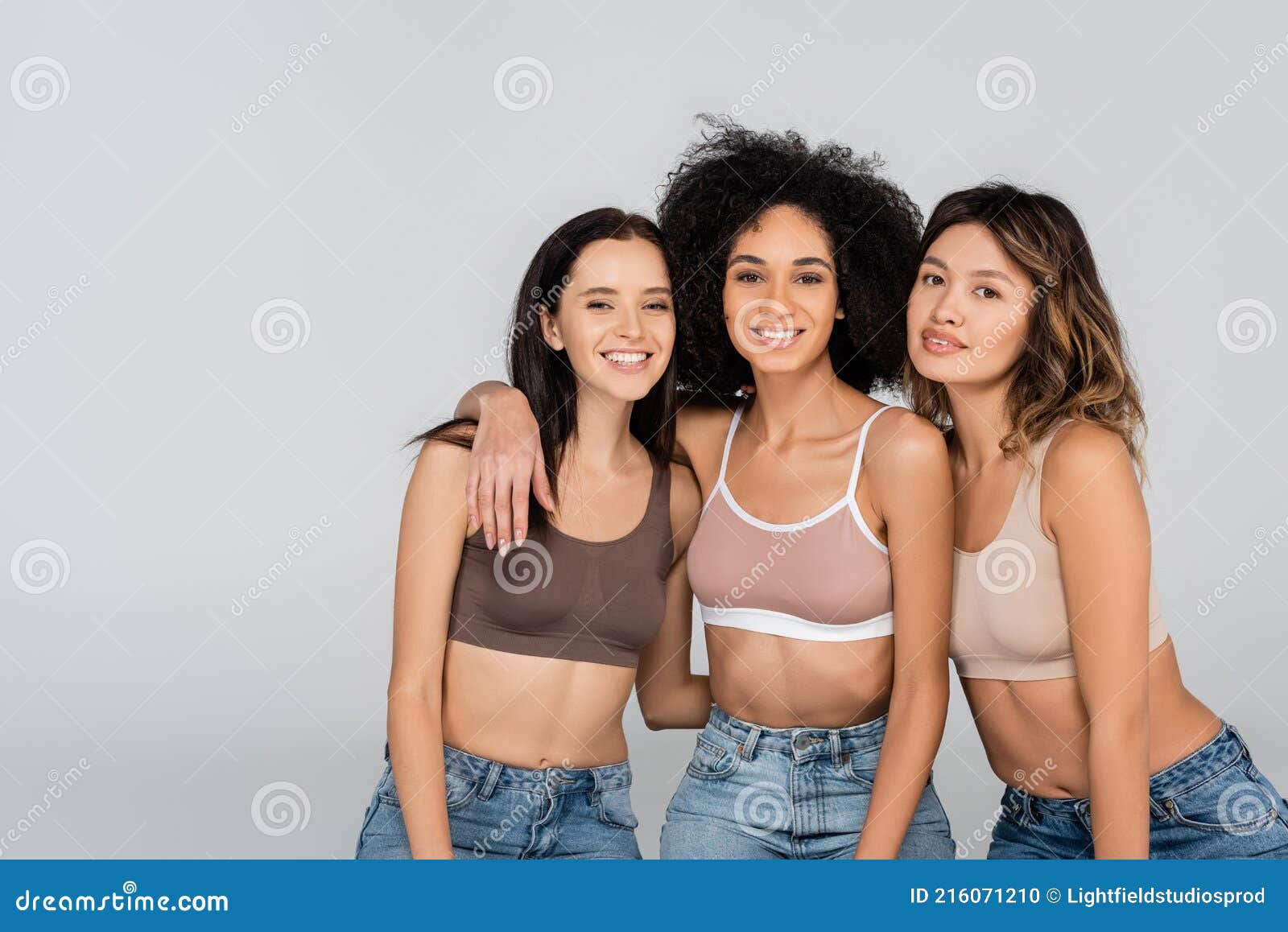 Young Interracial Women in Jeans and Stock Photo - Image of beauty, joyful:  216071210