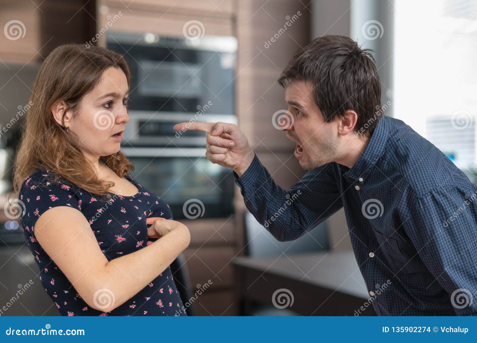 Young Jealousy Husband is Shouting and Blaming His Wife. Stock Photo