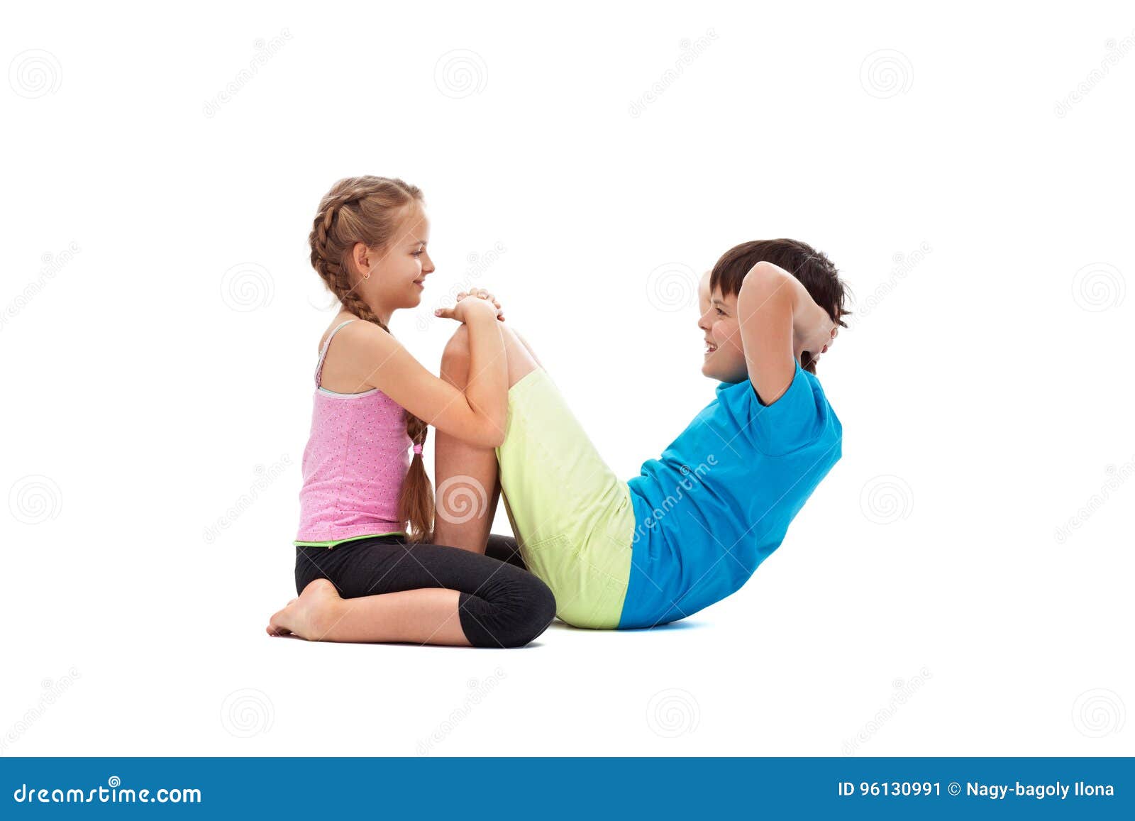 Young Kids Doing Abs Exercises Together Helping Each Other
