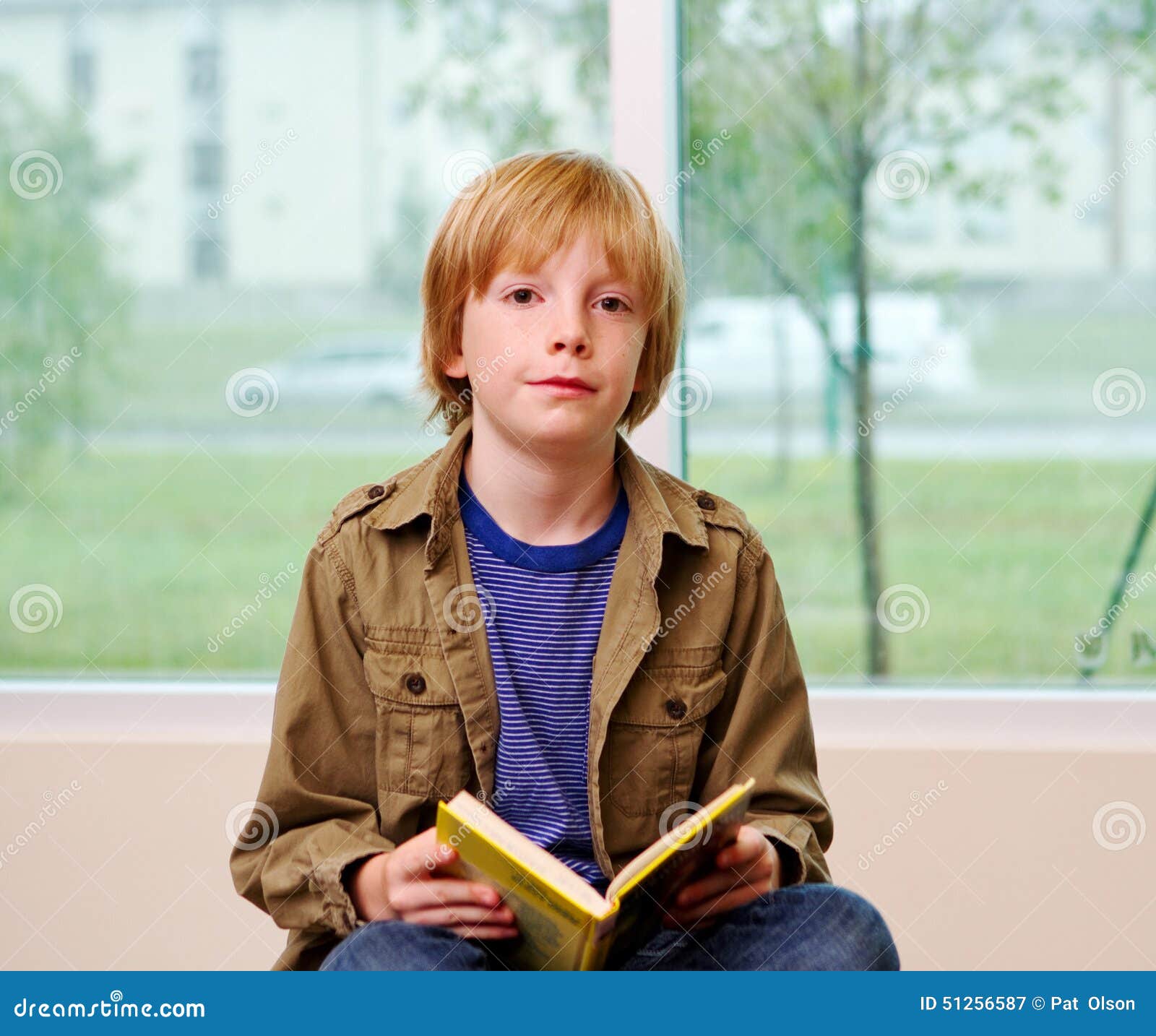 young lad reading book