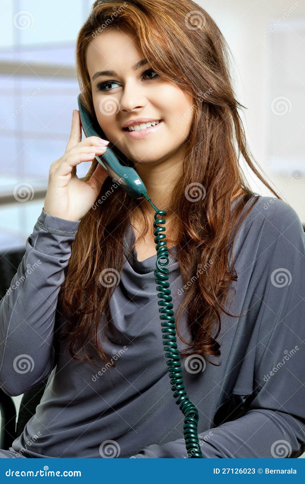 A Young Lady Answering Phone Call Stock Image - Image: 27126023