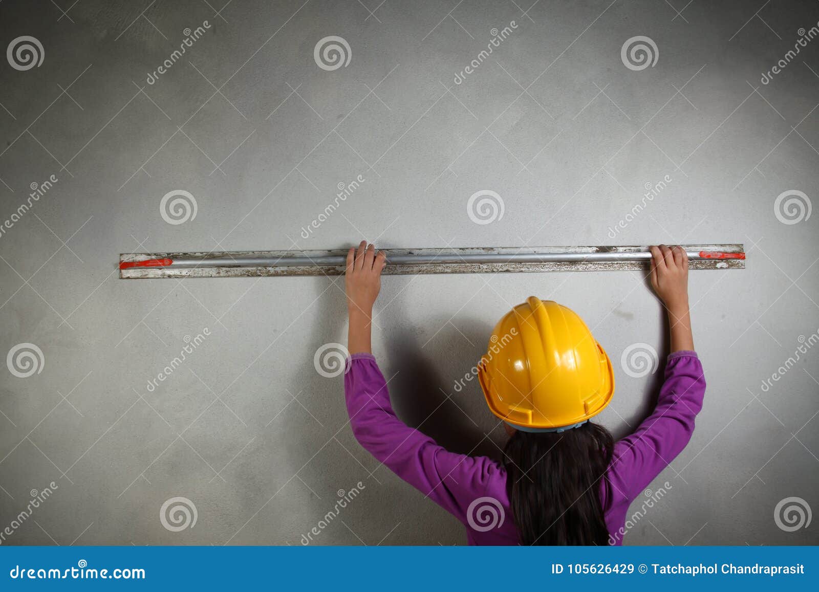 Young Lady with Concrete Cement Grouting Action. Stock Image - Image of