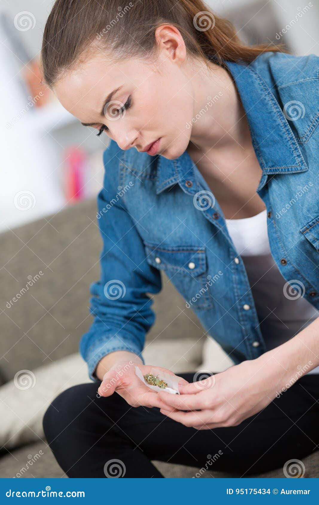 Young lady rolling joint stock photo. Image of person 95175434