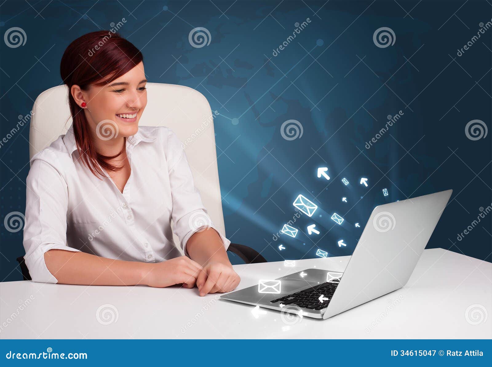 Pretty young lady sitting at dest and typing on laptop with message icons comming out