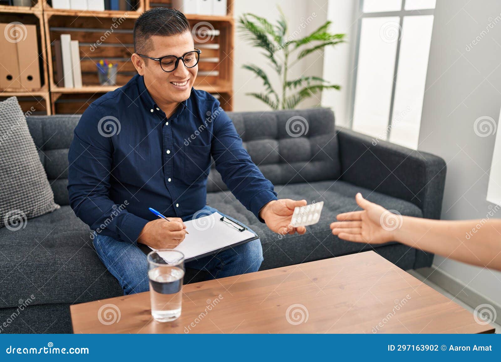 Young Latin Man Psychologist Prescribe Pills To Patient at Psychology