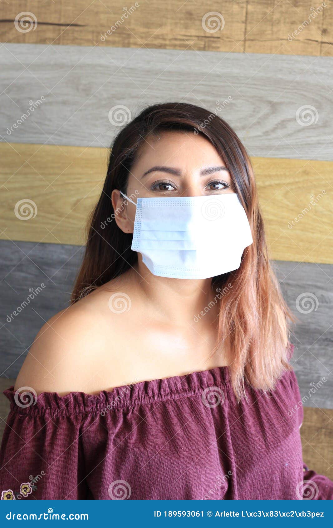 young latin woman with multilayer face masks for clinical use to prevent covid
