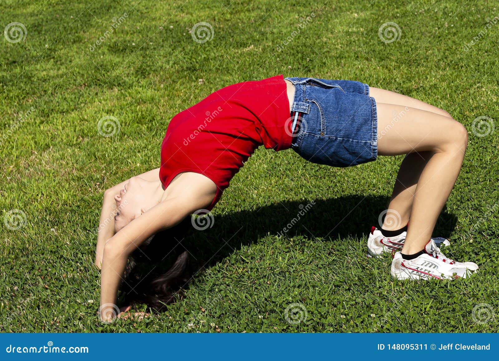 Young Hispanic Woman Bending Over Backwards On G