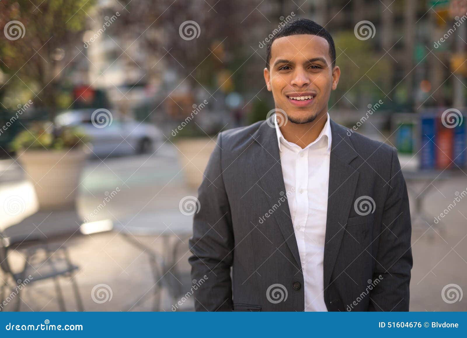 young latino man in city smile face