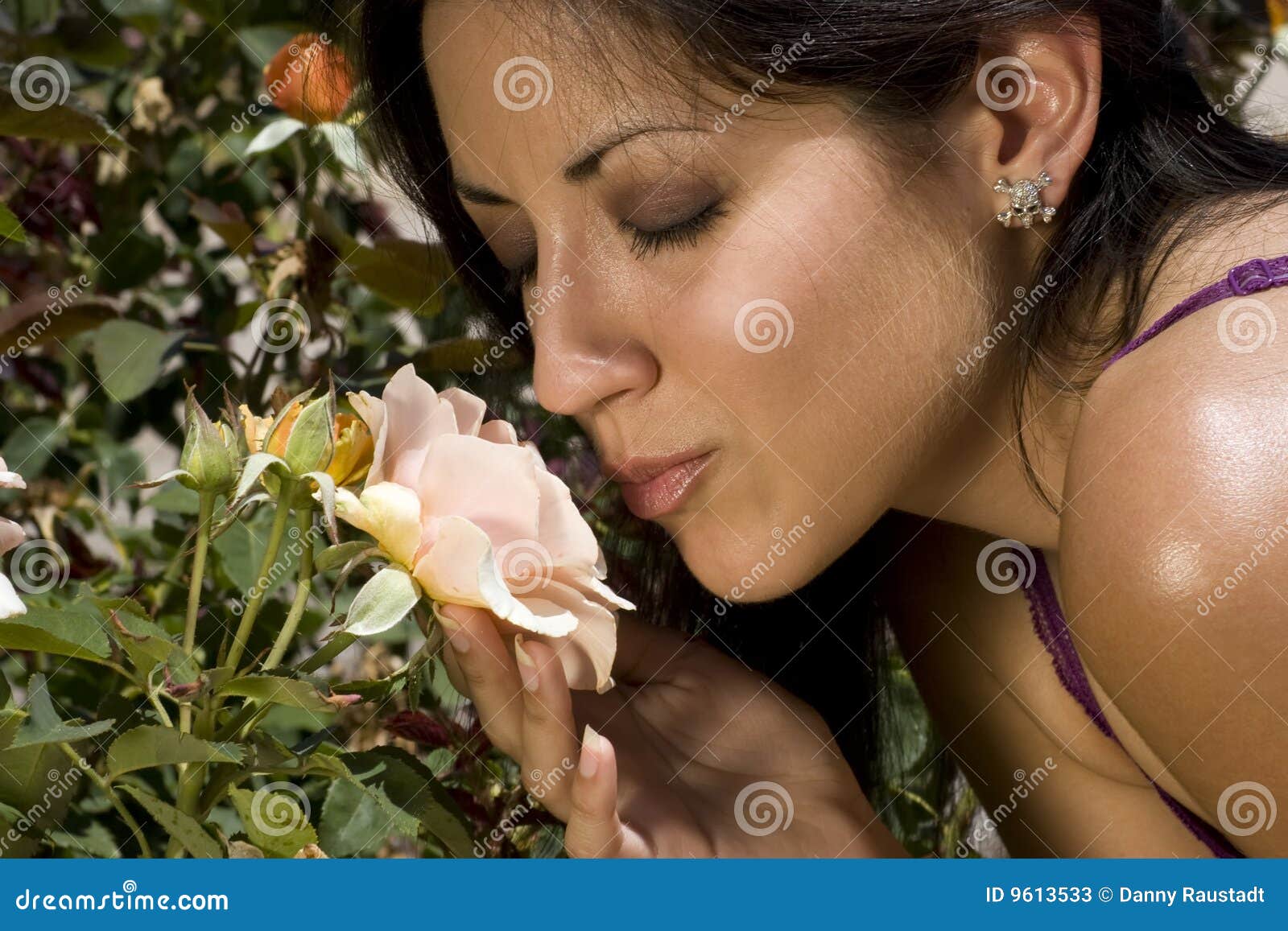 young latino woman and garden rose