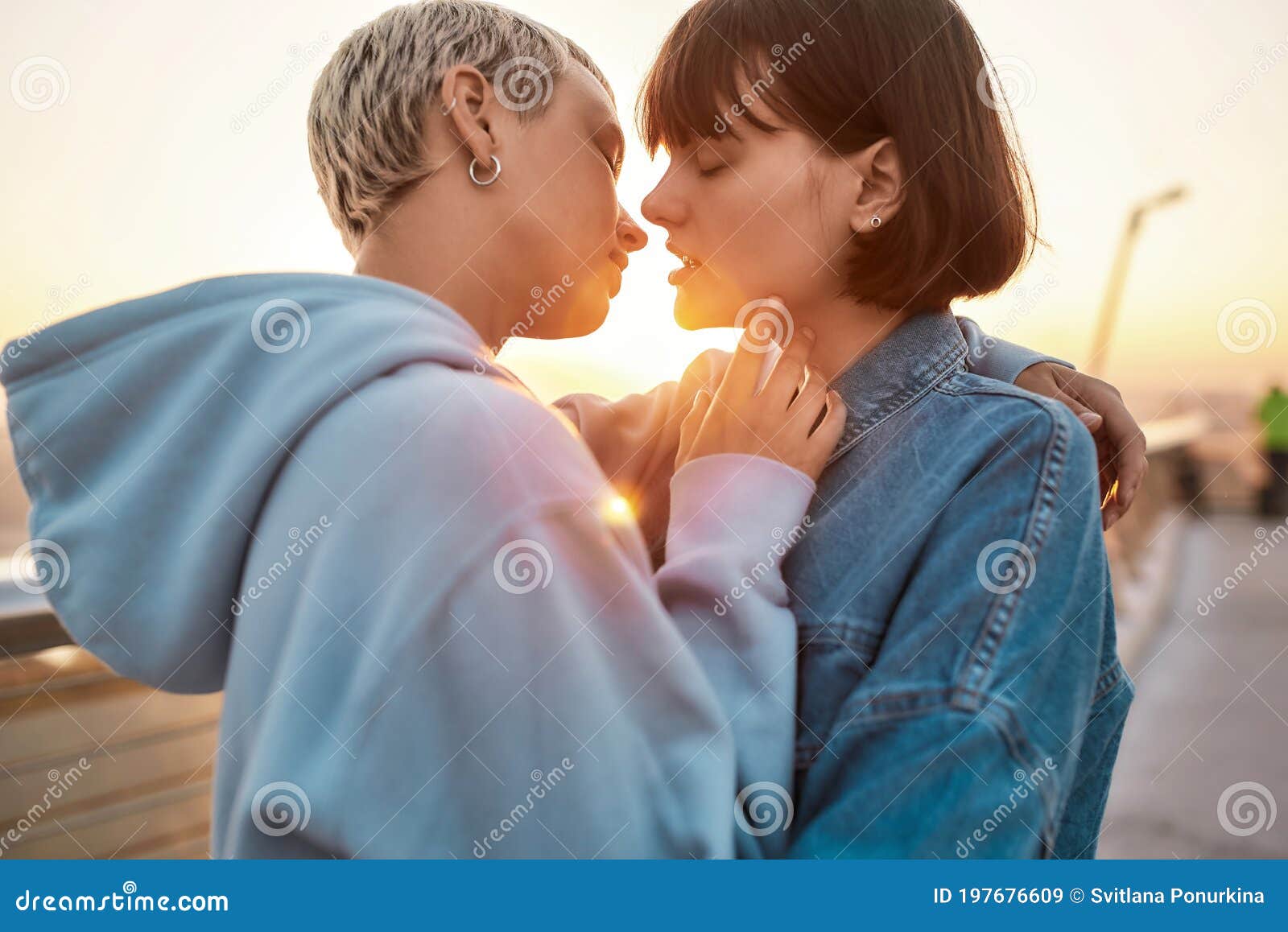 Young Lesbian Couple Having Romantic Moment Two Women Going To Kiss While Watching The Sunrise 