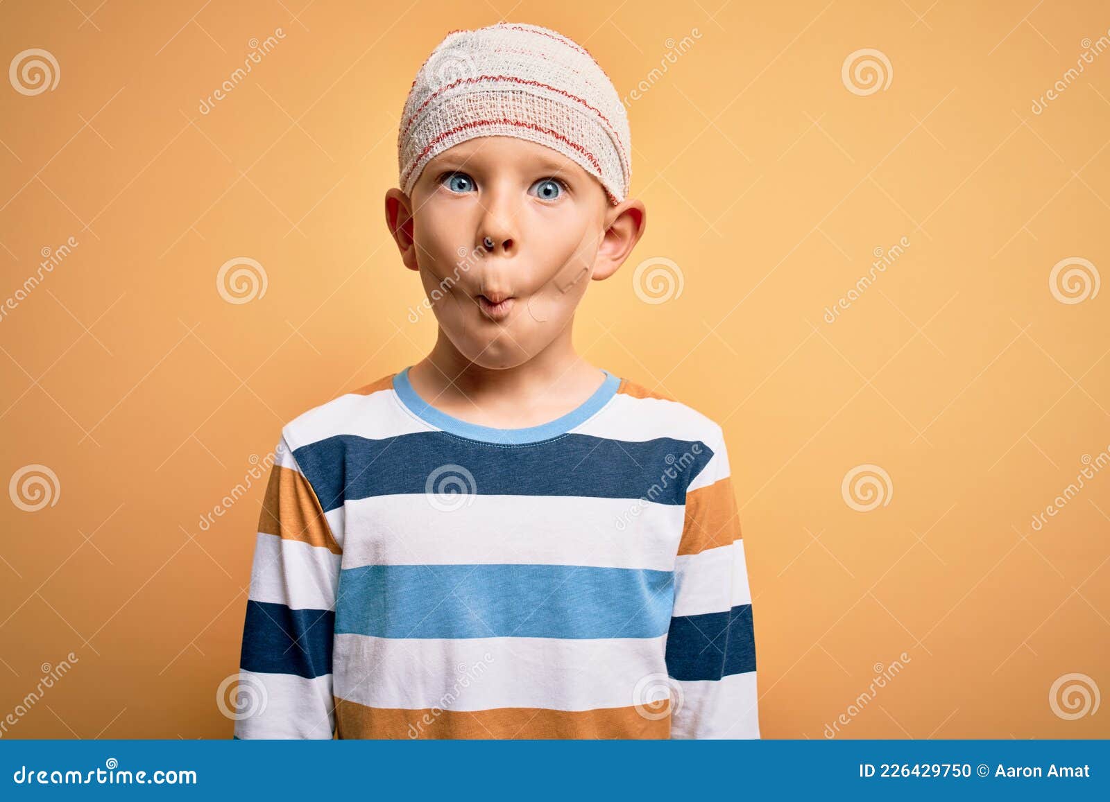 Young Little Caucasian Kid Injured Wearing Medical Bandage on Head