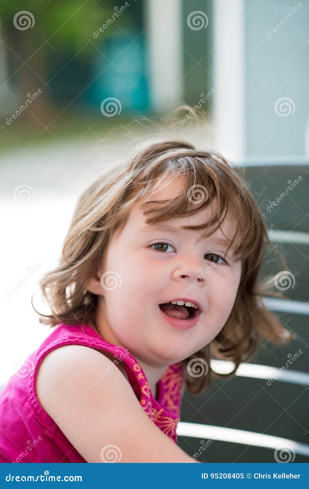Young Little Girl Sitting Down and Looking Happy Stock Image Image of