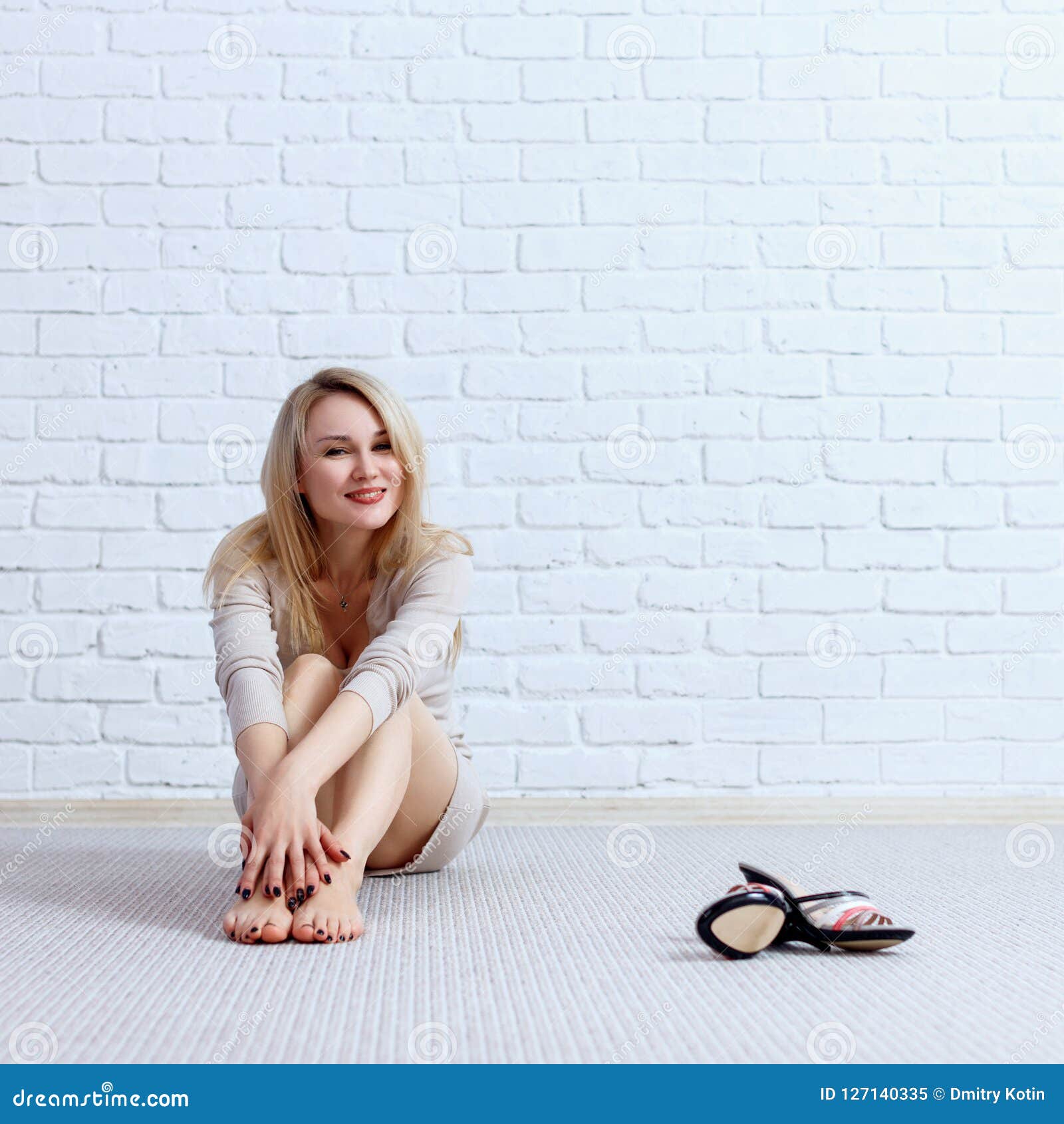 Young Lovely Woman In Dress Sitting On The Floor And Posing. Stock ...