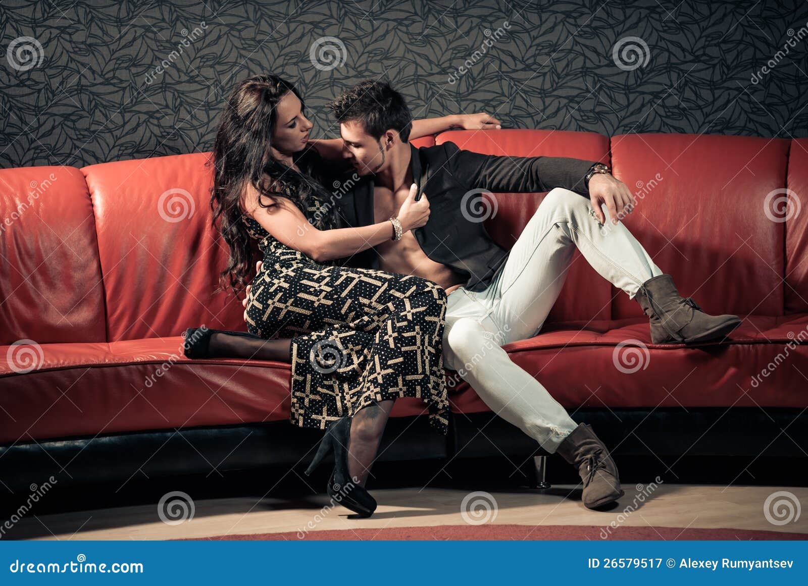 Young lovers on a sofa stock image. Image of hotel, room 26579517