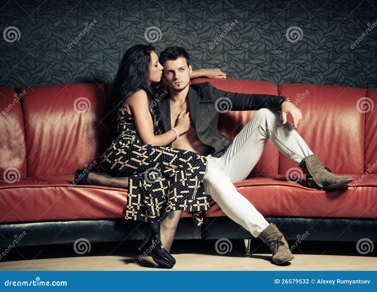 Young lovers on a sofa stock photo. Image of girlfriend 26579532