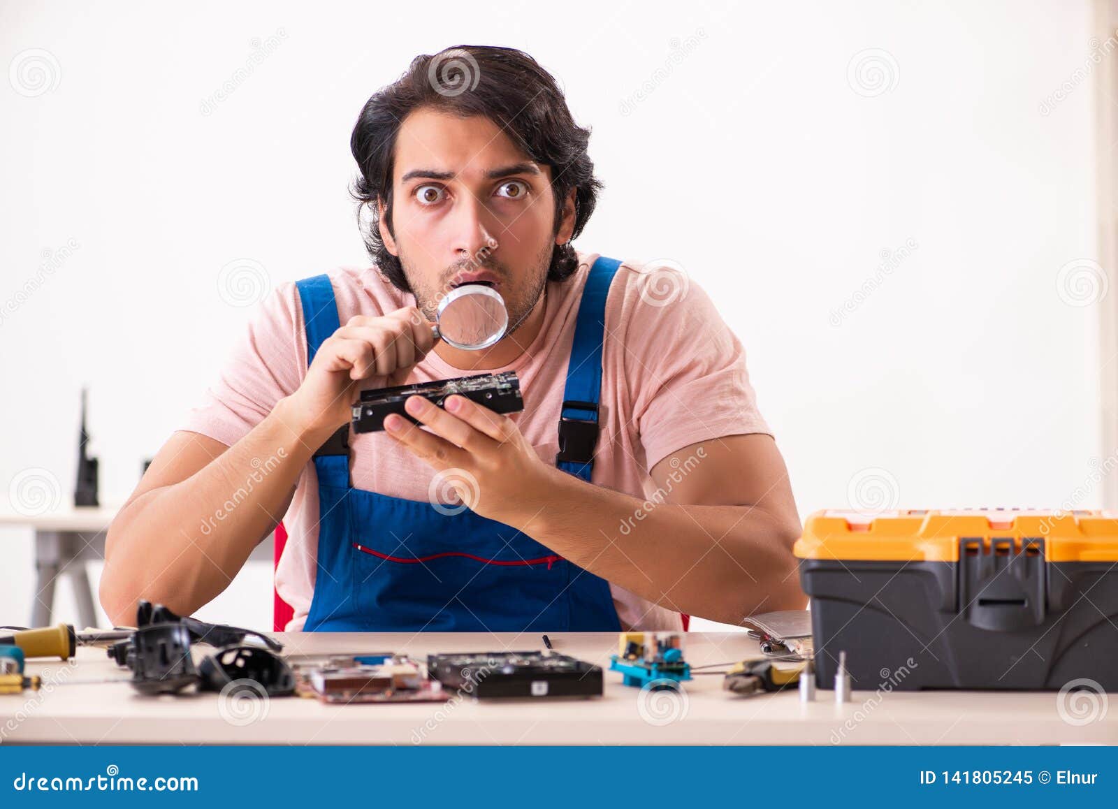 The Young Male Contractor Repairing Computer Stock Image Image of