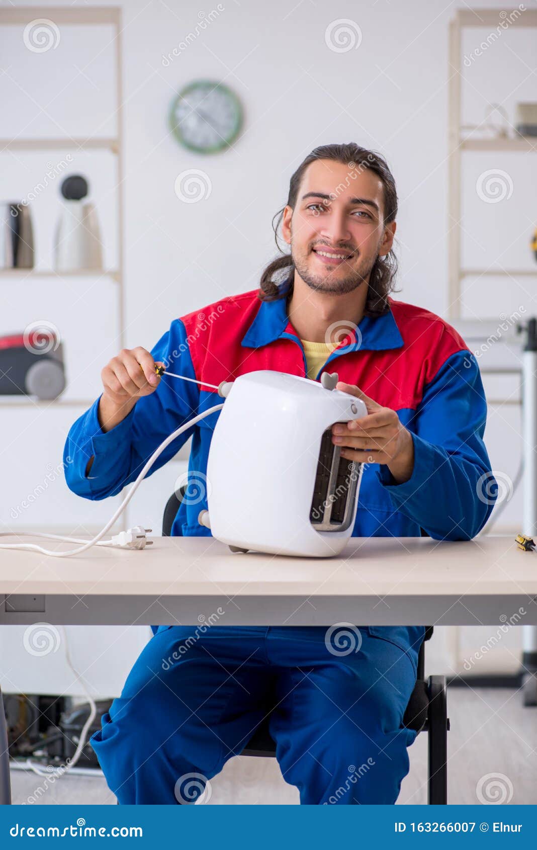 Young Male Contractor Repairing Toaster at Stock Image Image of problem, appliance