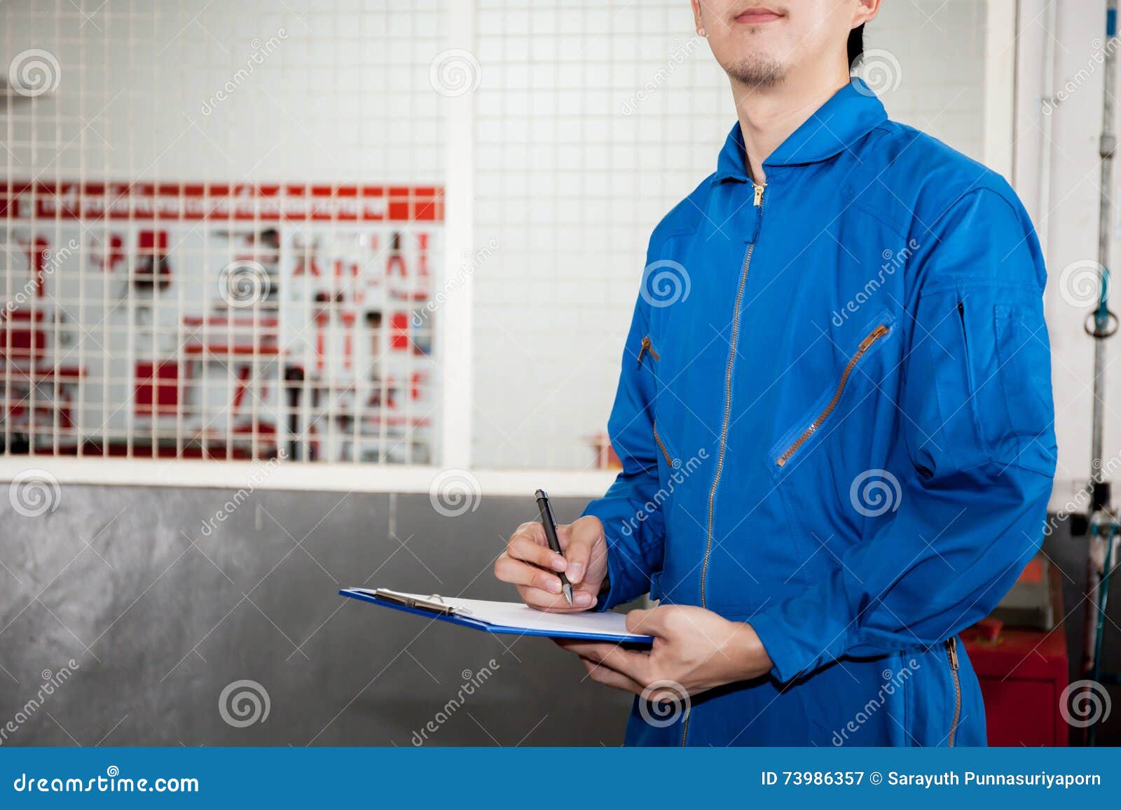 Young Male Engineer at Work in Mechanic Tools Storage Room Stock Image