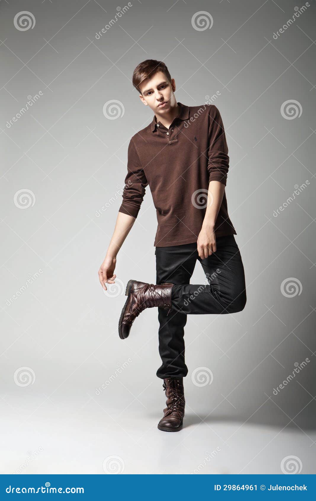 Sexy handsome male model posing in blue fashion suit and white style shirt  looking down on dark shadow background. Toned color fashion portrait Stock  Photo | Adobe Stock