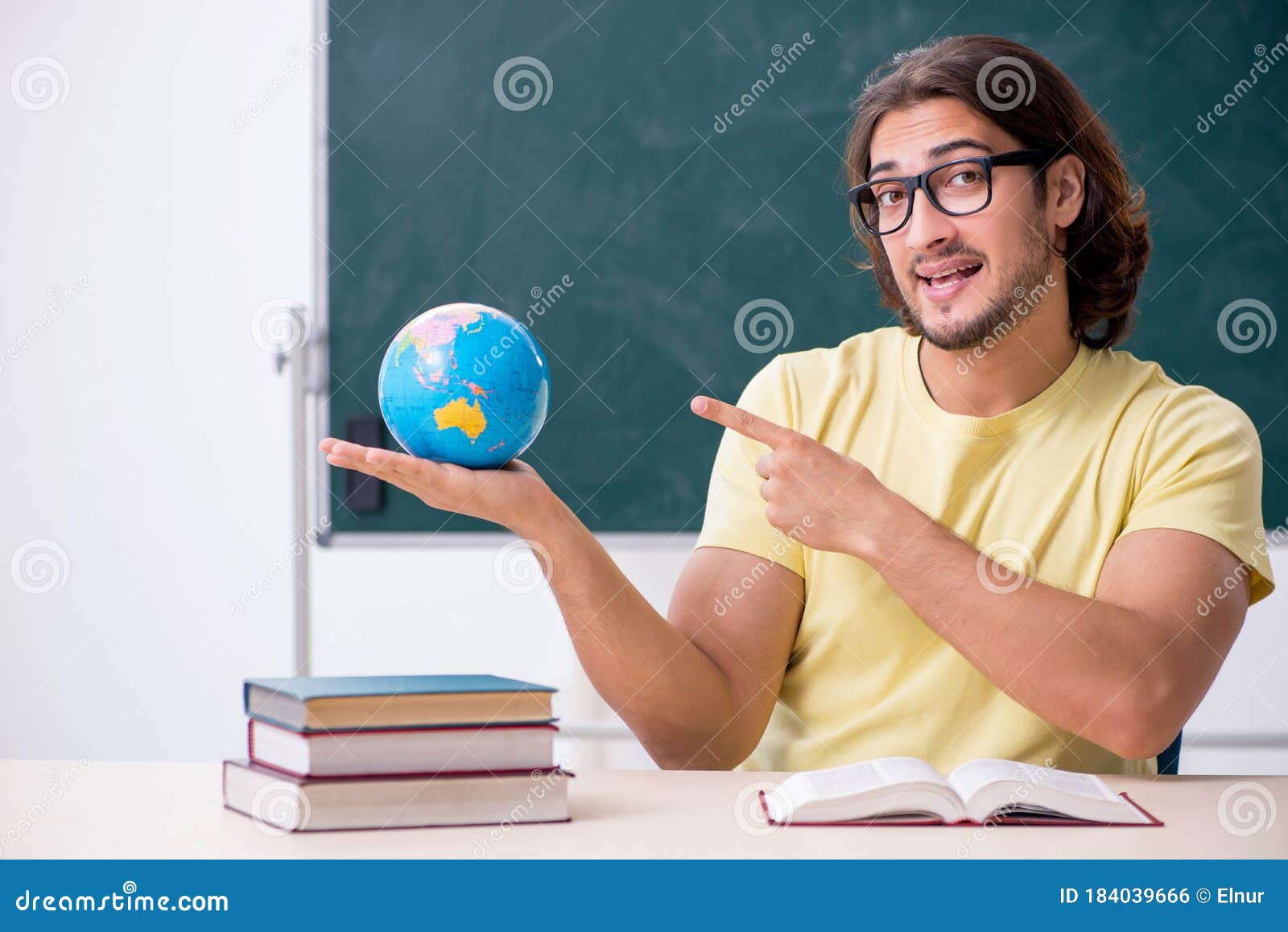 Young Male Geography Teacher in Front of Blackboard Stock Photo Image