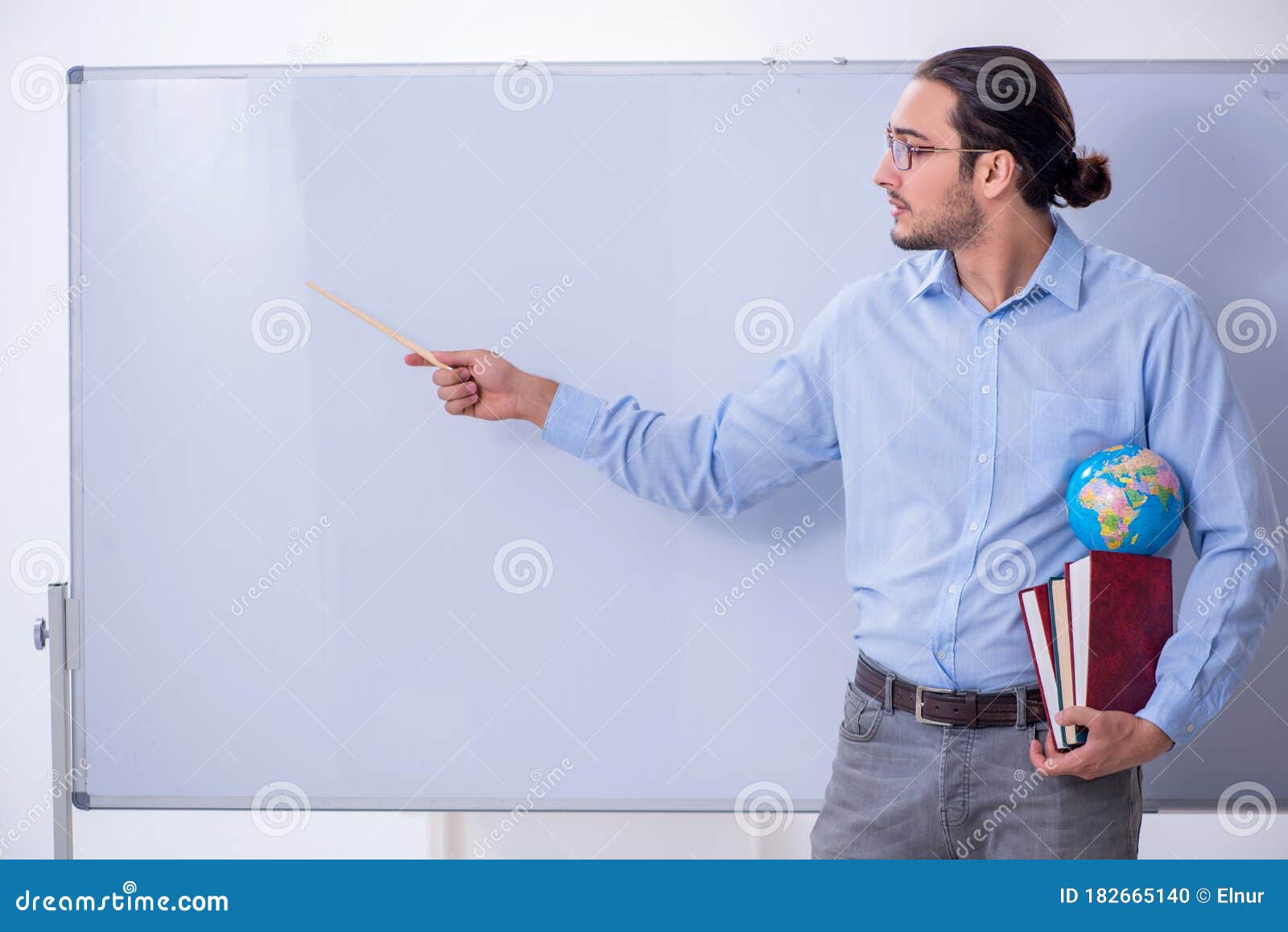 Young Male Geography Teacher in Front of Whiteboard Stock Photo Image