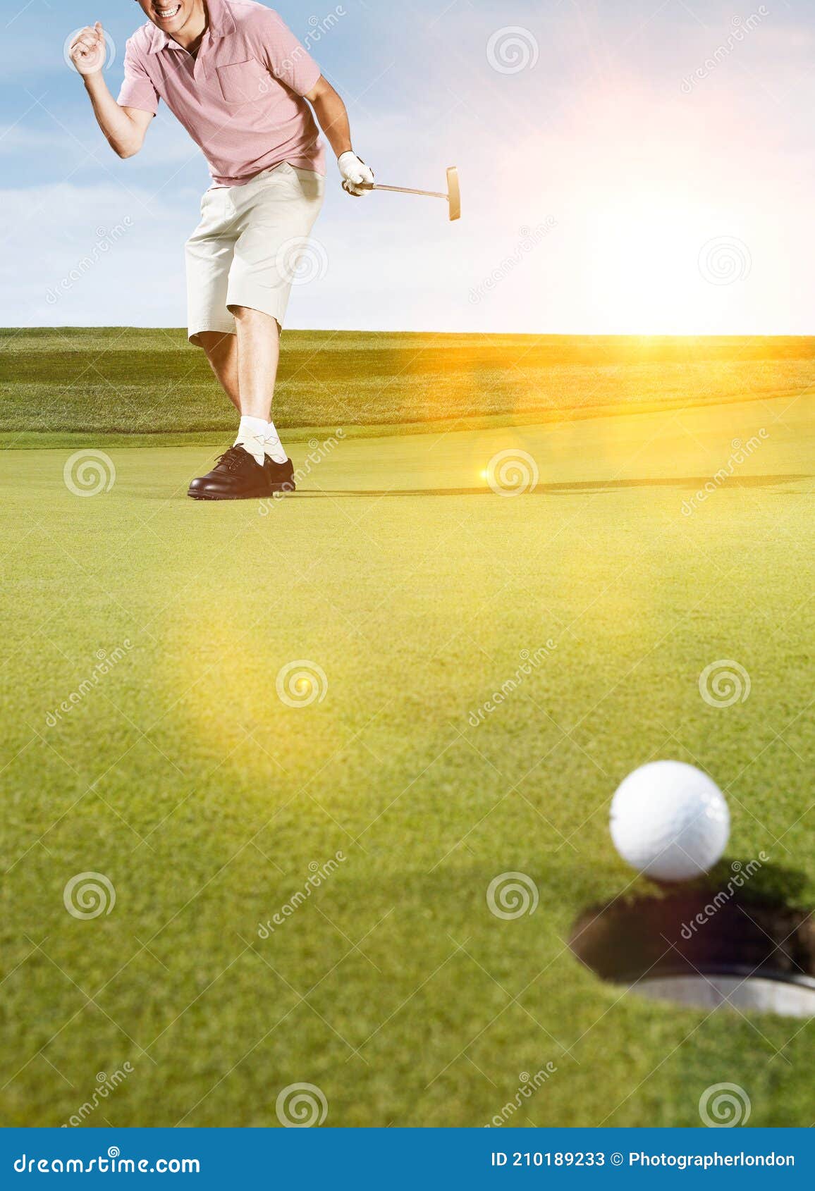 young male golfer celebrating birdie putt